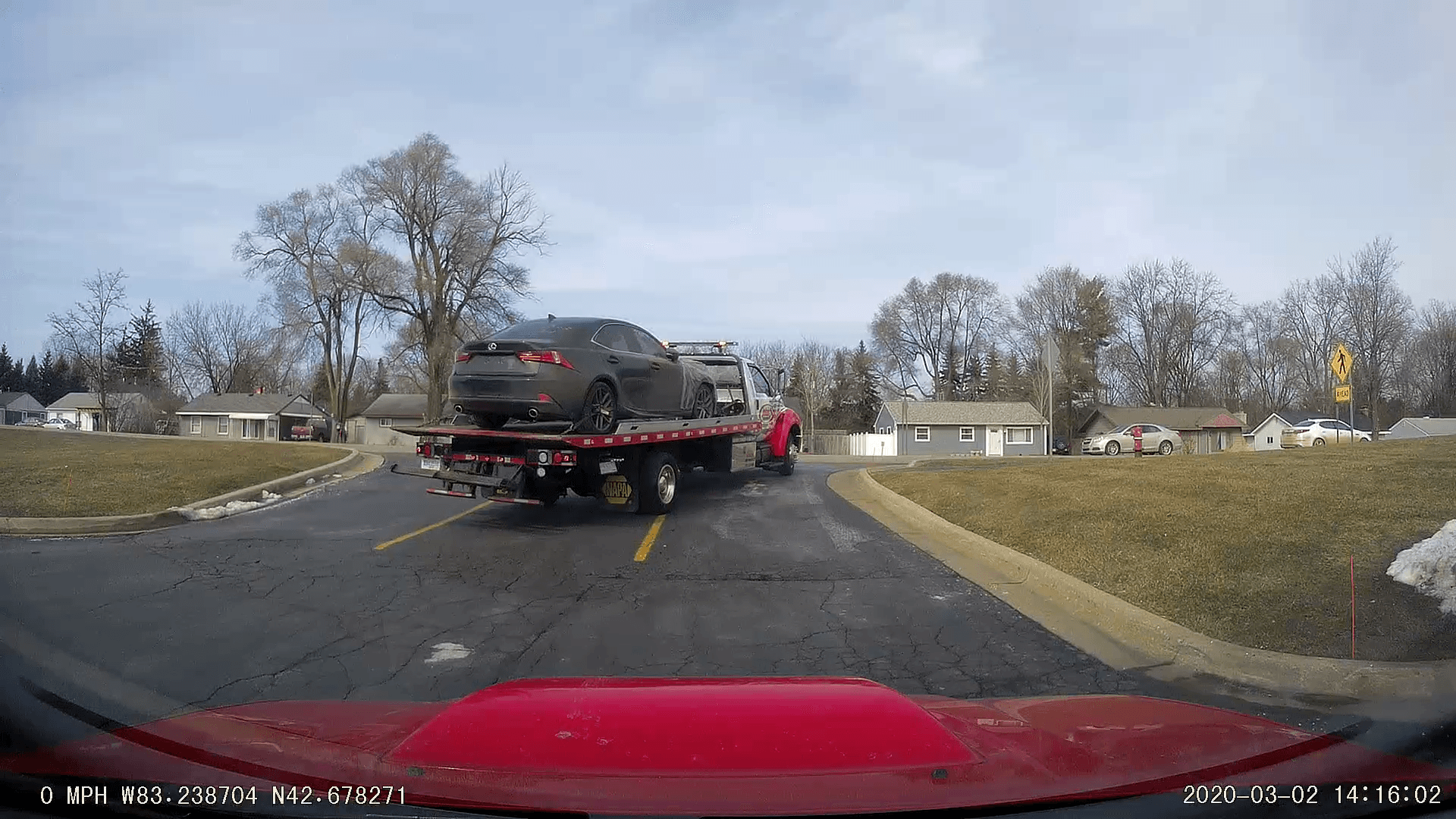 The car on the back of a tow truck